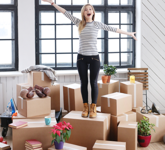 woman with cargo packages ready shipping moving standing laughing 1